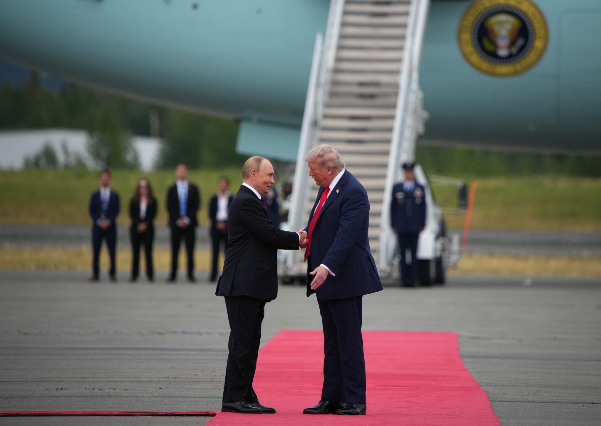 ANCHORAGE, ALASKA - AUGUST 15: U.S. President Donald Trump (R) greets Russian President Vladimir Putin as he arrives at Joint Base Elmendorf-Richardson on August 15, 2025 in Anchorage, Alaska. The two leaders are meeting for peace talks aimed at ending the war in Ukraine.  (Photo by Andrew Harnik/Getty Images)