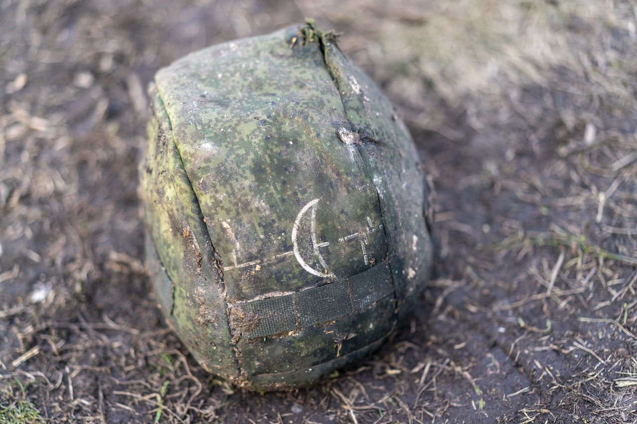 DONETSK OBLAST, UKRAINE - FEBRUARY 24: A view of a fallen Russian soldier's belongings as volunteers of a group called Black Tulip examine personal belongings of Russian soldiers whose bodies were collected on the second anniversary of Russia-Ukraine war in Donetsk Oblast, Ukraine on February 24, 2024. Black Tulip's aim is to collect Russian bodies to exchange for Ukrainians, since a soldier cannot be declared dead by the state until there is a body. However, the process of extracting the bodies is extremely risky. Like many areas, Krasnopillia is littered with mines as Russia has been using remote mining systems that scatter tiny mines from the air. There have also been several instances of Russian forces booby-trapping bodies and houses before retreating. (Photo by Jose Colon/Anadolu via Getty Images)