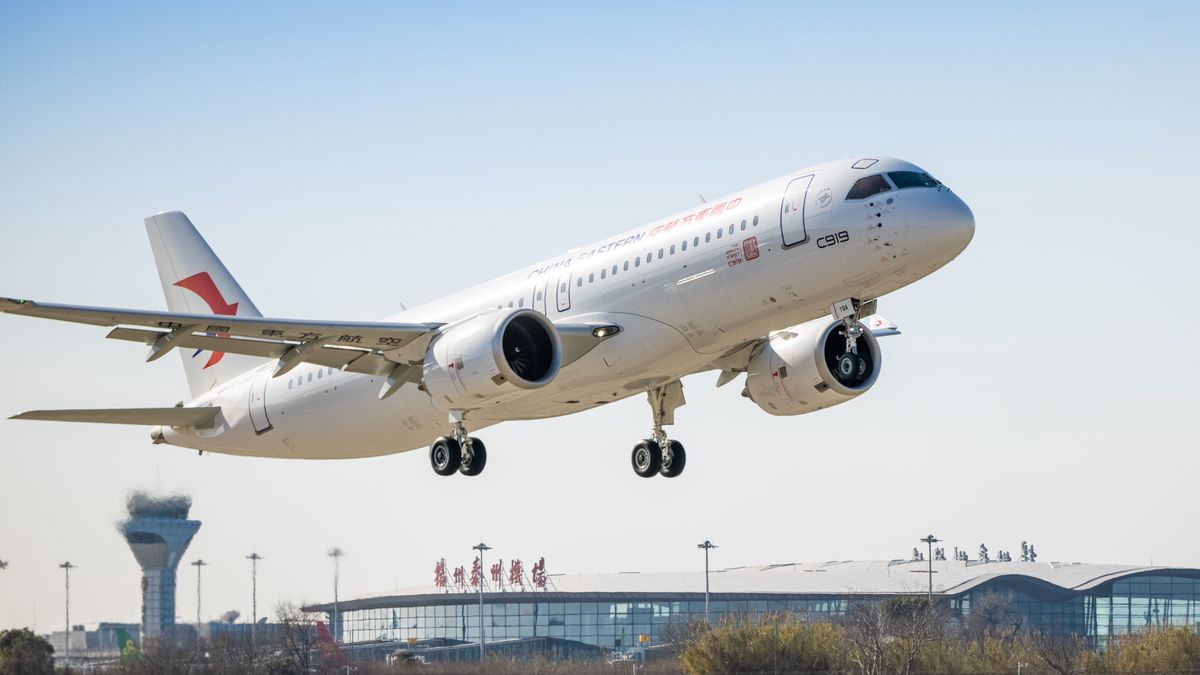 YANGZHOU, CHINA - DECEMBER 23: The first C919 large passenger aircraft of China Eastern Airlines lands at Yangzhou Taizhou International Airport during a training flight on December 23, 2022 in Yangzhou, Jiangsu Province of China. The first C919, China's first domestically-developed narrow-body passenger jet, is expected to be put into commercial operation in early 2023. (Photo by Yu Xing/VCG via Getty Images)