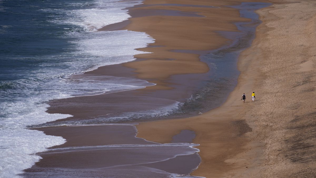 NAZARE, PORTUGAL - OCTOBER 04: An aerial view of the Nazare beach in the Nazare, a city on the Atlantic coast, Portugal on October 04, 2025. Nazare, which receives harsh ocean winds especially in the winter months, attracts attention with its quiet settlement life besides the giant waves. Nazare city welcomes its visitors with its long coastline and narrow streets and historical buildings. (Photo by Ercin Erturk/Anadolu via Getty Images)