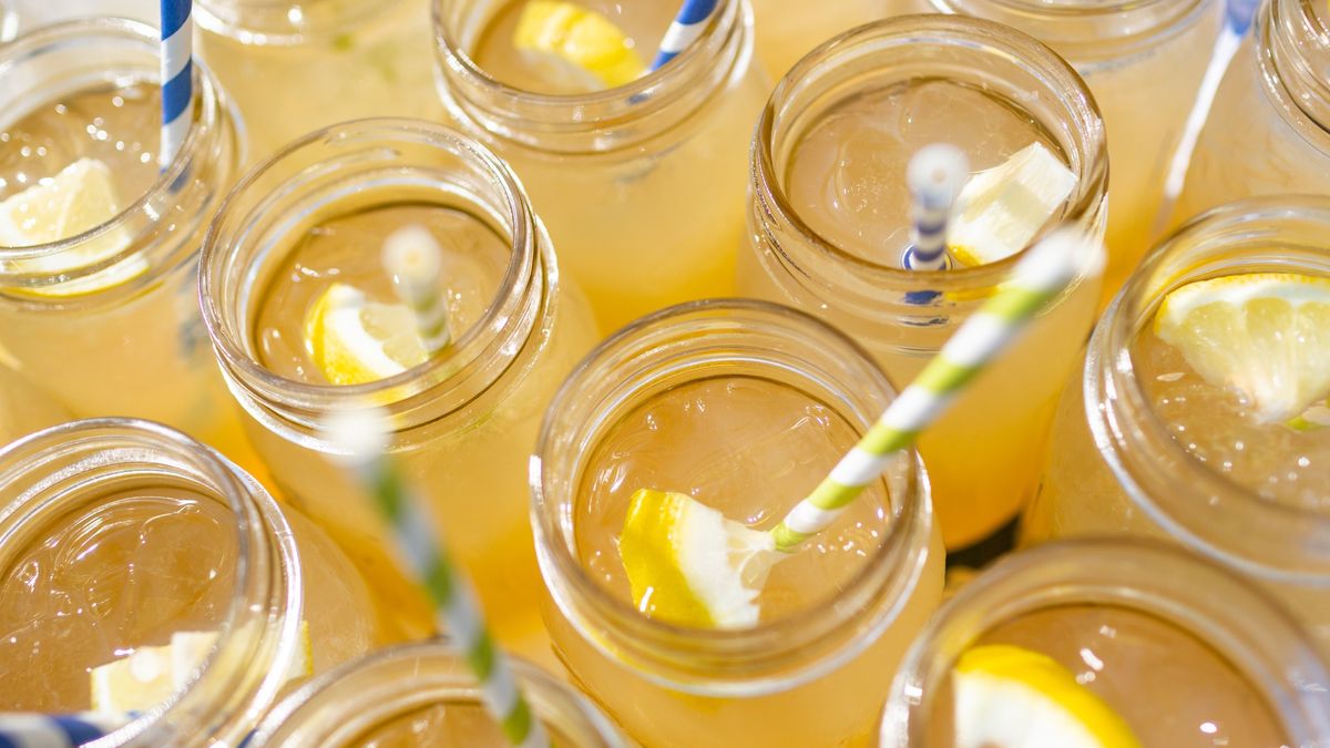 Mason jars filled with lemonade and iced teaAbove view of lemonade and iced tea with colorful strawsKevin Trimmer