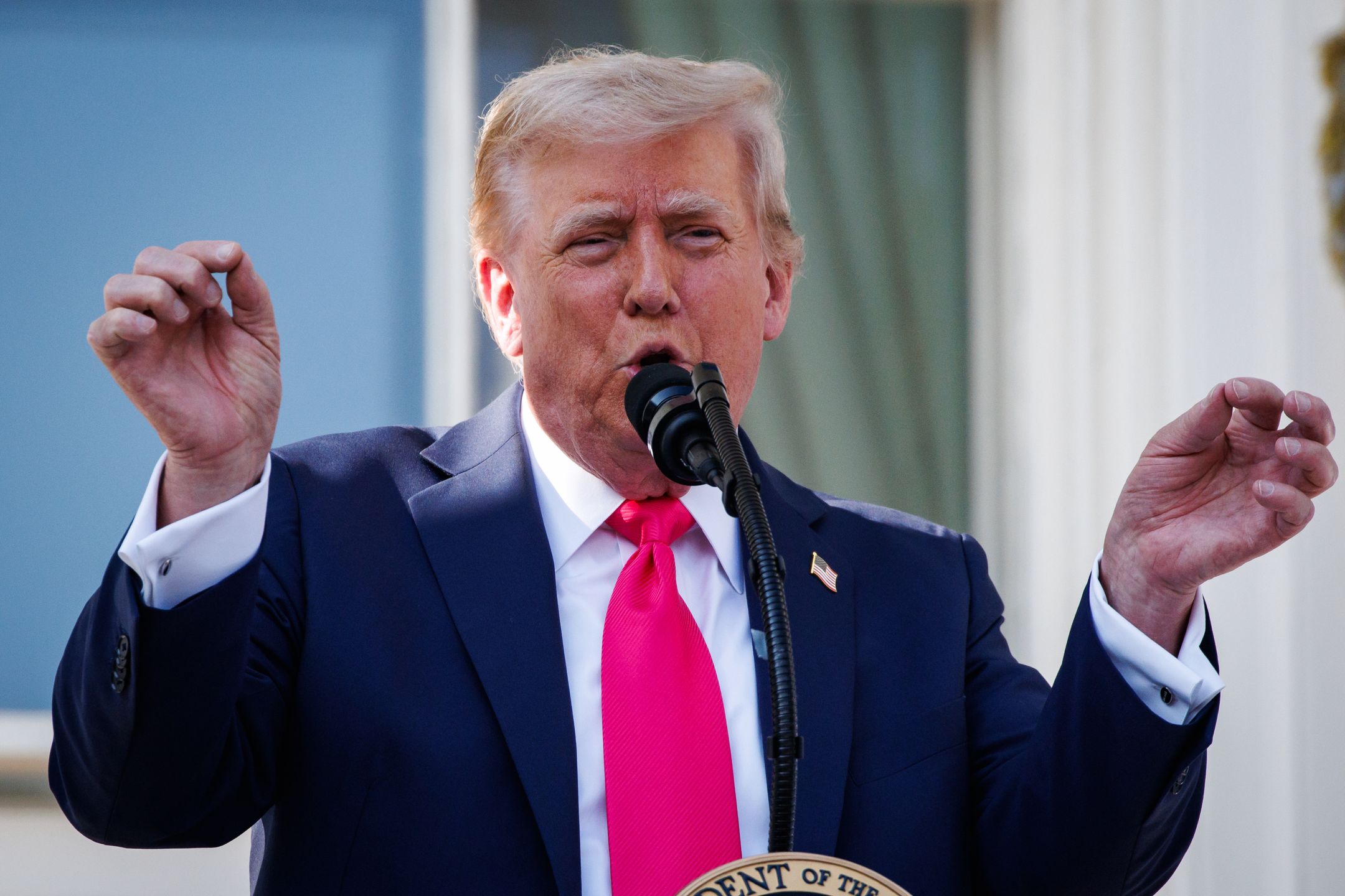 WASHINGTON, DC - JULY 04: U.S. President Donald Trump, joined by first lady Melania Trump, delivers remarks during an Independence Day military family picnic on the South Lawn of the White House on July 04, 2025 in Washington, DC. At the picnic President Trump signed the One, Big Beautiful Bill Act into law after Congress passed the bill yesterday following weeks of negotiations with Republican holdouts. The bill makes permanent President Donald Trump's 2017 tax cuts, increase spending on defense and immigration enforcement and temporarily cut taxes on tips, while cutting funding for Medicaid, food assistance and other social safety net programs. (Photo by Samuel Corum/Getty Images)