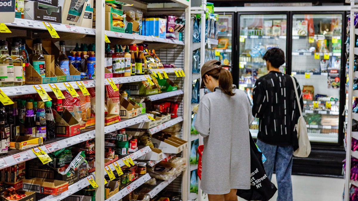 MELBOURNE, VICTORIA, AUSTRALIA - 2026/03/16: A woman seen shopping inside the Coles supermarket. Rising fuel prices and inflation are placing increasing pressure on household budgets across Australia, with higher transport costs expected to drive up supermarket and grocery prices in the coming months. (Photo by Ye Myo Khant/SOPA Images/LightRocket via Getty Images)
