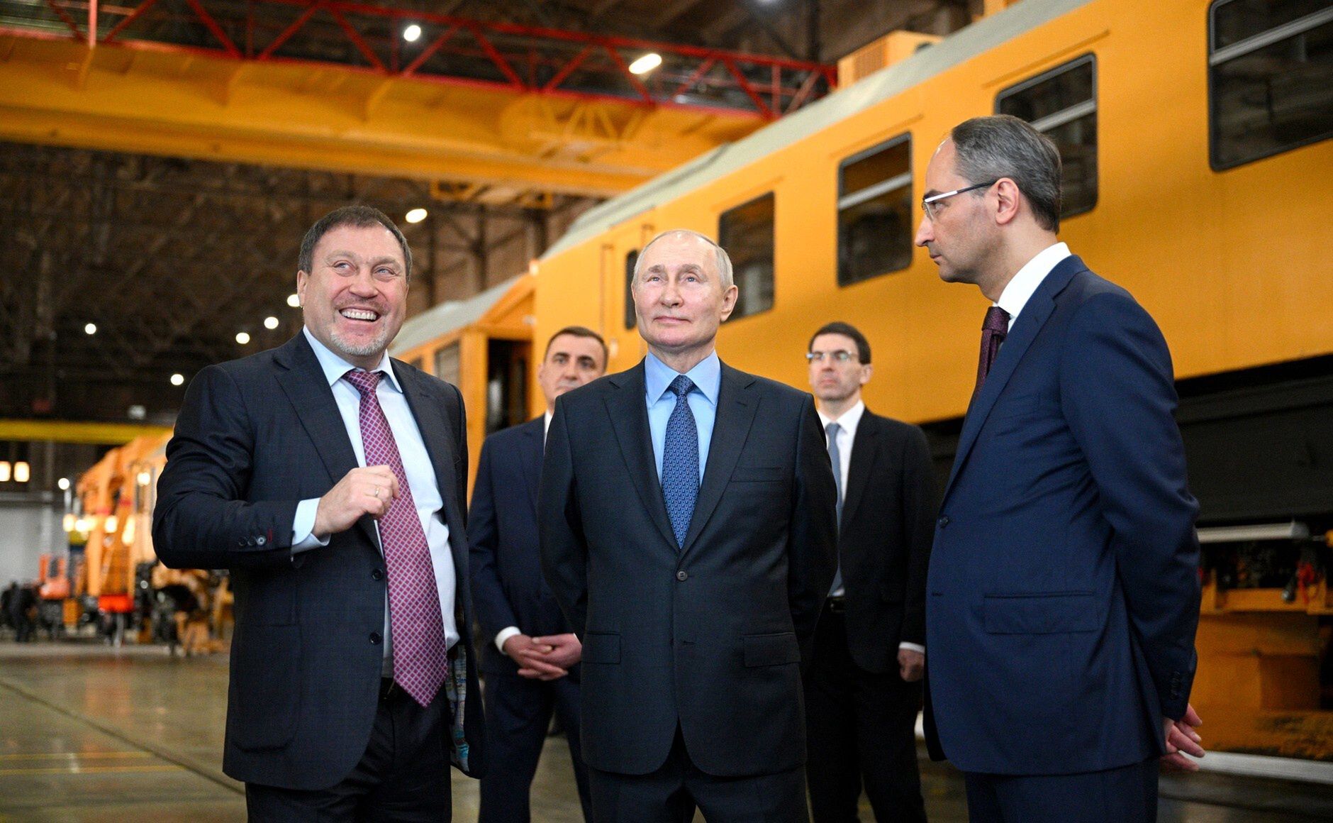 TULA, RUSSIA - APRIL 04: (----EDITORIAL USE ONLY - MANDATORY CREDIT - 'KREMLIN PRESS OFFICE / HANDOUT' - NO MARKETING NO ADVERTISING CAMPAIGNS - DISTRIBUTED AS A SERVICE TO CLIENTS----) Russian President Vladimir Putin (C) inspects at facility of Tulazheldormash (Tula Railway Engineering Plant), manufacturer of heavy track equipment and equipment for the construction, renovation and maintenance of railway tracks, in Tula, Russia, on April 04, 2023. (Photo by Kremlin Press Office / Handout/Anadolu Agency via Getty Images)