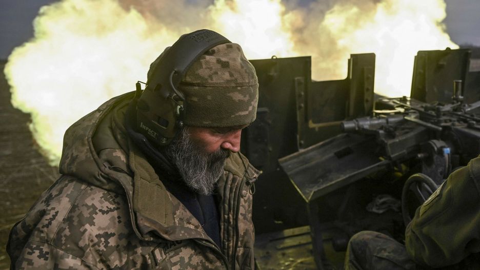 Temporary
Ukrainian serviceman Chas, reloads an anti-aircraft gun as his comrades fire at Russian positions near Bakhmut on March 20, 2023. - A small group of old friends has refurbished a 1950s artillery piece to go fight together on the front lines. The six men are firing a Soviet-era 57mm S-60 gun, a piece usually seen at the entrances to large cities on traffic circles or official buildings. "The gun you see here comes from a warehouse. It was stored as scrap metal. So we repaired it, refurbished it and now we use it to protect our native Ukraine," Volodymyr, 37, who commands the artillery unit, told AFP. (Photo by Aris Messinis / AFP)
ARIS MESSINIS