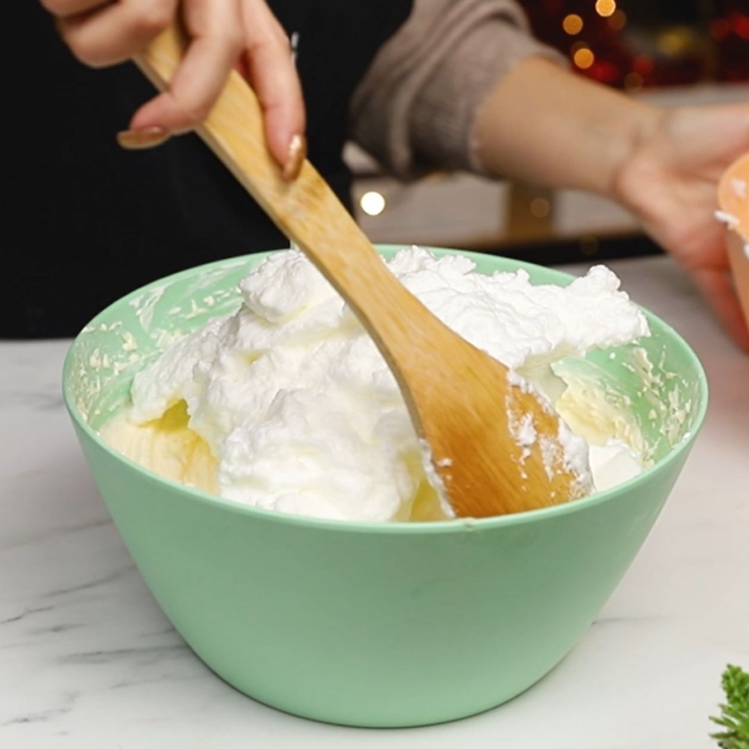 As the last ingredient, beaten egg whites go into the bowl.