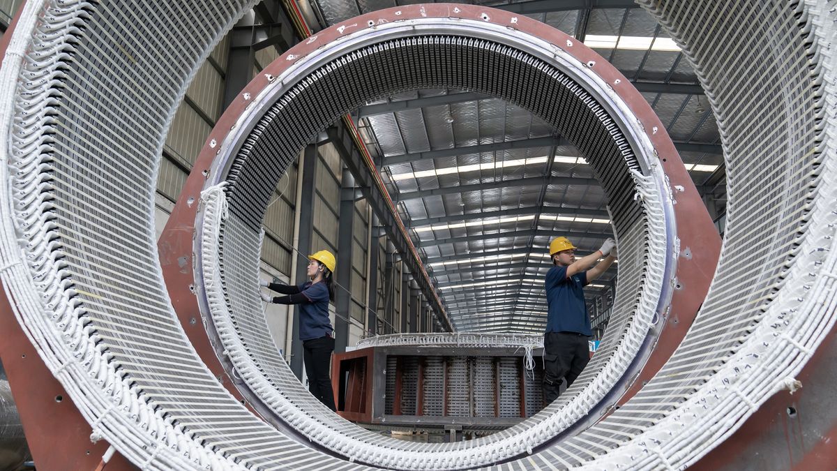 HAIAN, CHINA - MAY 17: Workers manufacture high-voltage motors at the workshop of Elom Motor Group Co., Ltd. on May 17, 2024 in Haian, Nantong City, Jiangsu Province of China. (Photo by Zhai Huiyong/VCG via Getty Images)