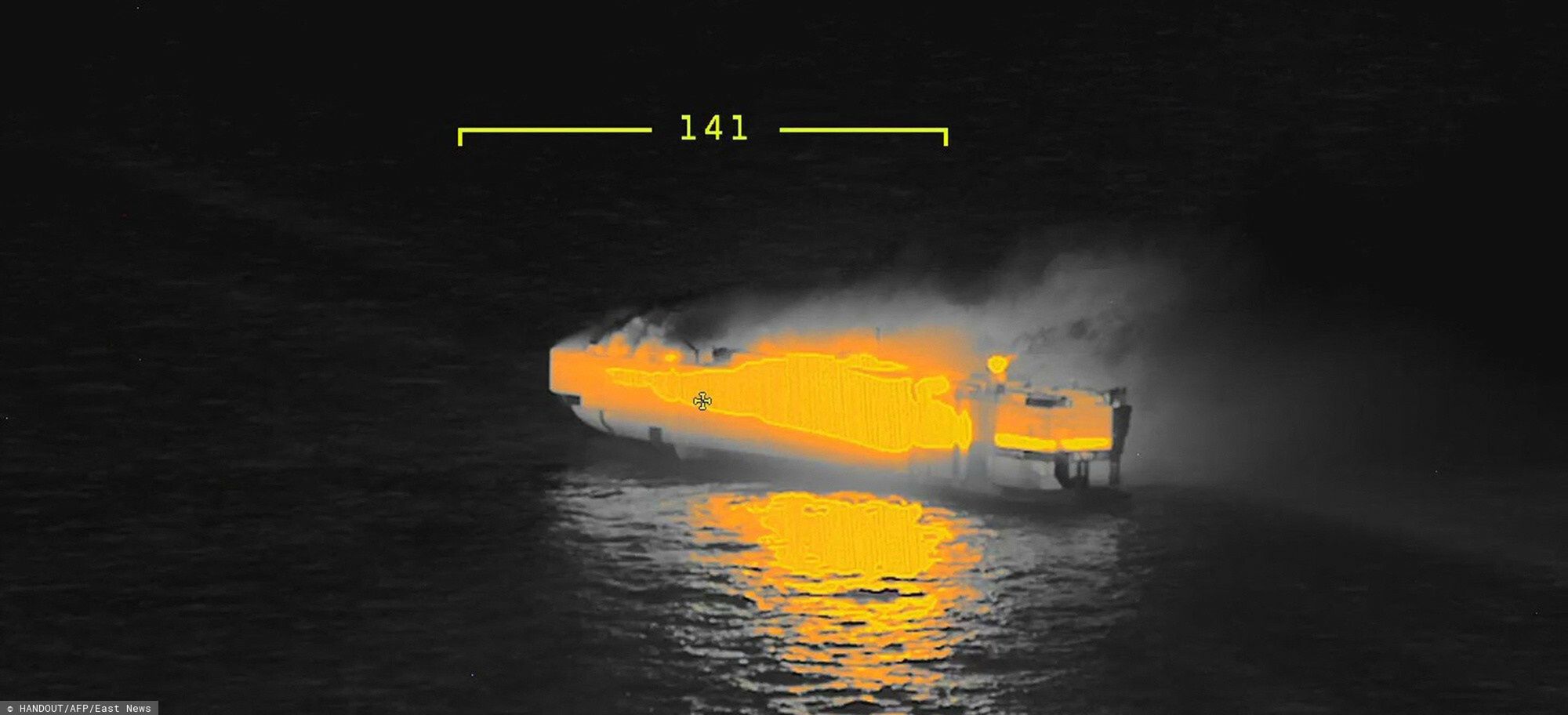 TemporaryThis handout thermal imaging photograph taken and released on July 26, 2023 by the Netherlands coastguards, shows a fire the Panamanian-registered car carrier ship Fremantle Highway, off the coast of the northern Dutch island of Ameland. One sailor died and several others were injured after a fire broke out on a car carrier ship off the Netherlands on Wednesday, the Dutch coastguard said. Rescue personnel received a call shortly after midnight (2200 GMT Tuesday) saying a fire had started on the Fremantle Highway, a Panamanian-registered ship with 3,000 vehicles on board, about 14.5 nautical miles (27 kilometres) off the northern Dutch island of Ameland. (Photo by Handout / Netherlands Coastguards / AFP) / RESTRICTED TO EDITORIAL USE - MANDATORY CREDIT "AFP PHOTO /  NETHERLANDS COASTGUARDS" - NO MARKETING NO ADVERTISING CAMPAIGNS - DISTRIBUTED AS A SERVICE TO CLIENTSHANDOUT