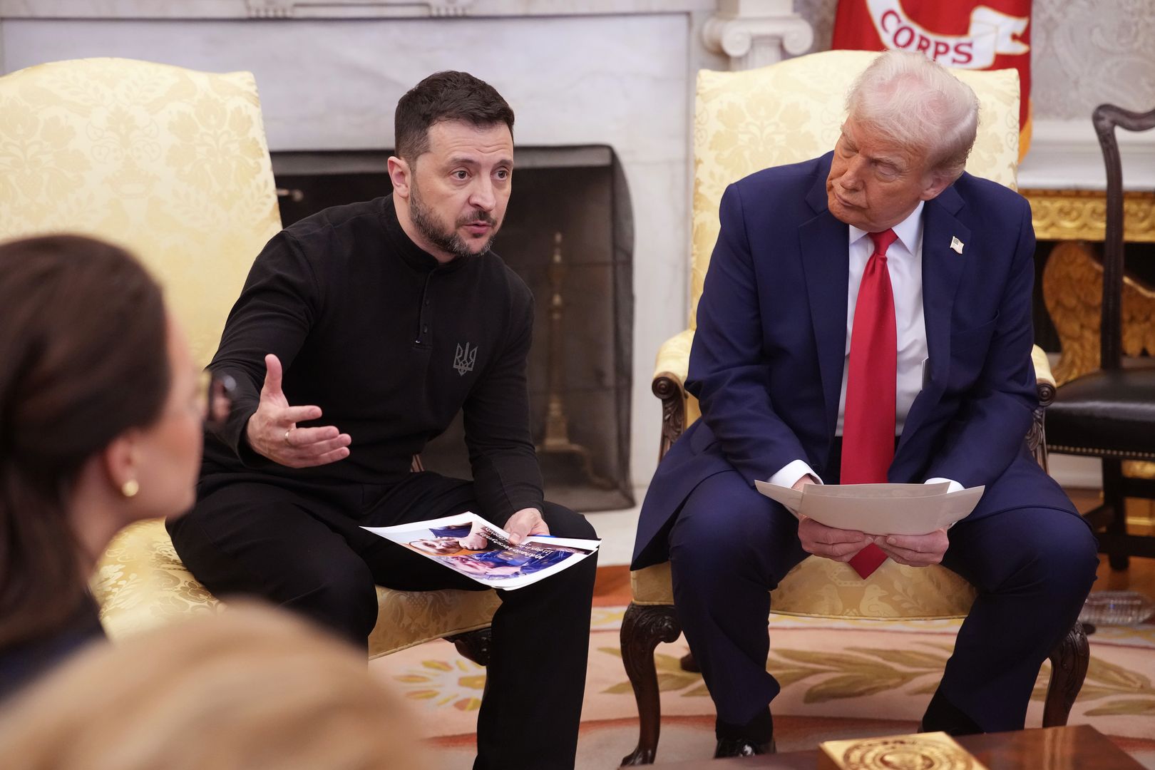 WASHINGTON, DC - FEBRUARY 28: Ukrainian president Volodymyr Zelensky holds photos of Ukrainians who were captures by Russian troops as he meets with U.S. President Donald Trump in the Oval Office at the White House on February 28, 2025 in Washington, DC. Trump and Zelensky are meeting today to sign a preliminary agreement on sharing Ukraine’s mineral resources that Trump says will allow America to recoup aid provided to Kyiv while supporting Ukraine’s economy. (Photo by Andrew Harnik/Getty Images)