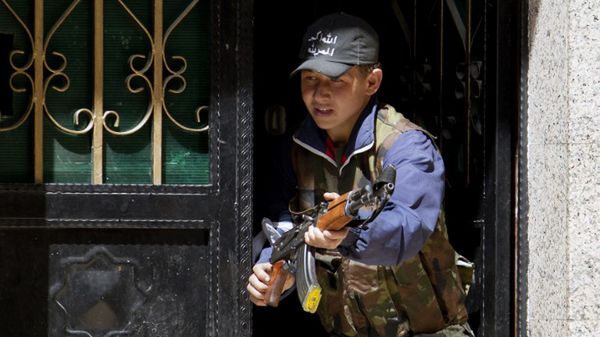 Młody syryjski rebeliant, Aleppo, 2013 r.