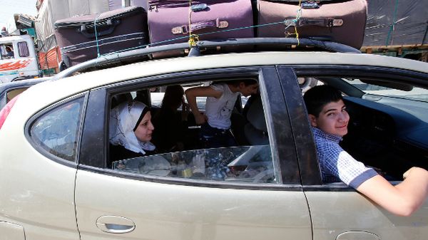 Rodzina syryjskich uchodźców na granicy z Libanem