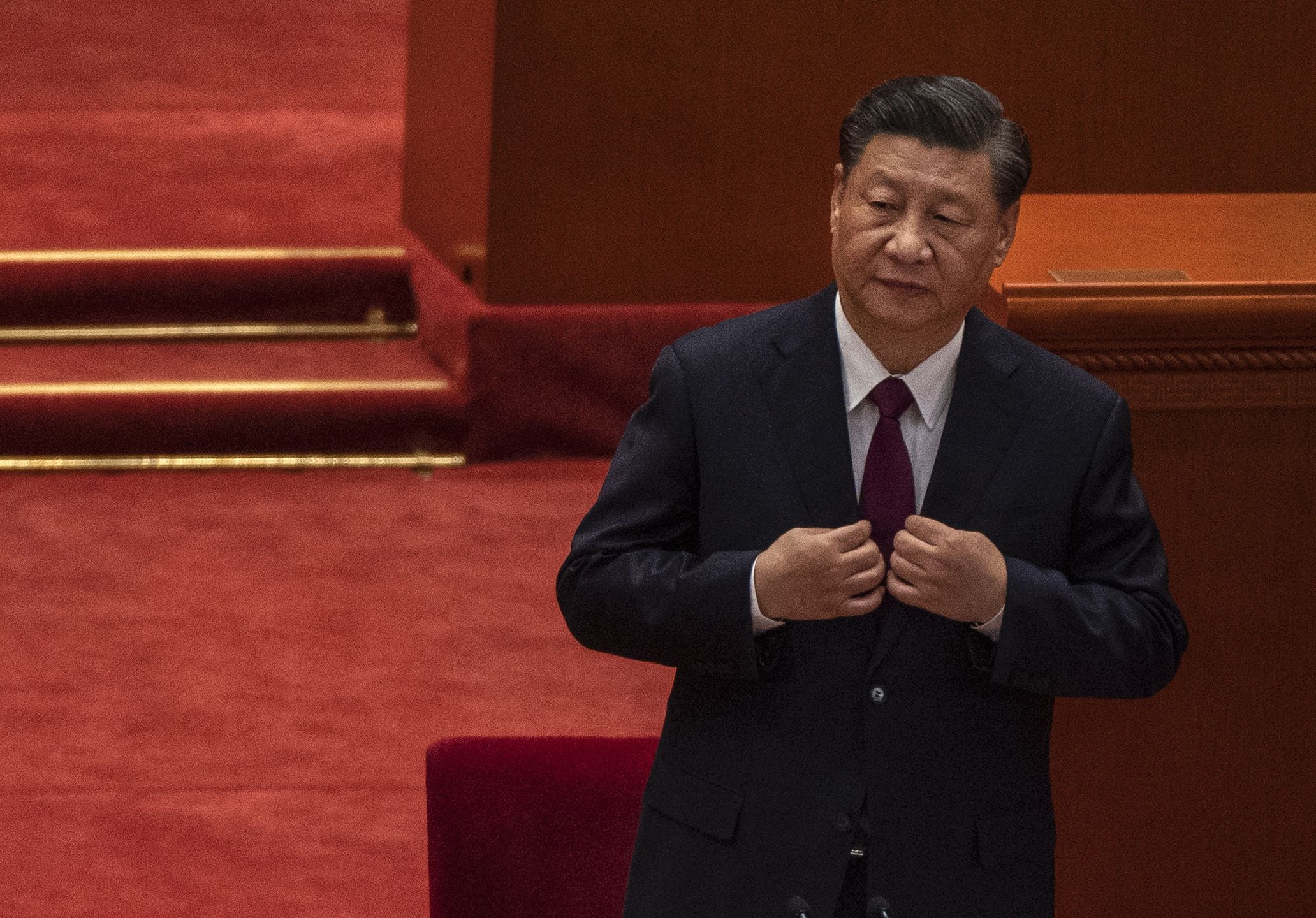 BEIJING, CHINA - APRIL 08: Chinese President Xi Jinping adjusts his jacket at a ceremony to honour contributions to the Beijing 2022 Winter Olympics and Paralympics at the Great Hall of the People on April 8, 2022 in Beijing, China. (Photo by Kevin Frayer/Getty Images)
