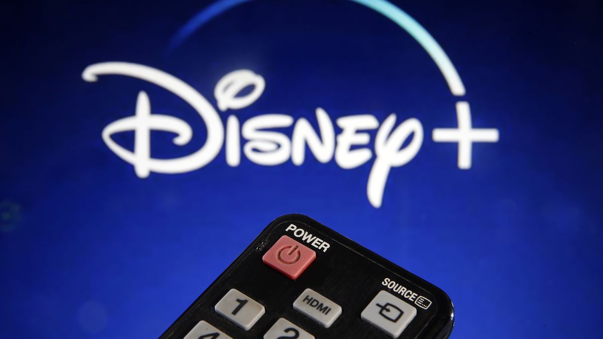 PARIS, FRANCE - MARCH 28: In this photo illustration, a remote control is seen in front of a television screen showing a Disney + logo on March 28, 2020 in Paris, France. At the request of the French government, the Disney + streaming platform has decided to postpone its launch in France to April 7. (Photo by Chesnot/Getty Images)