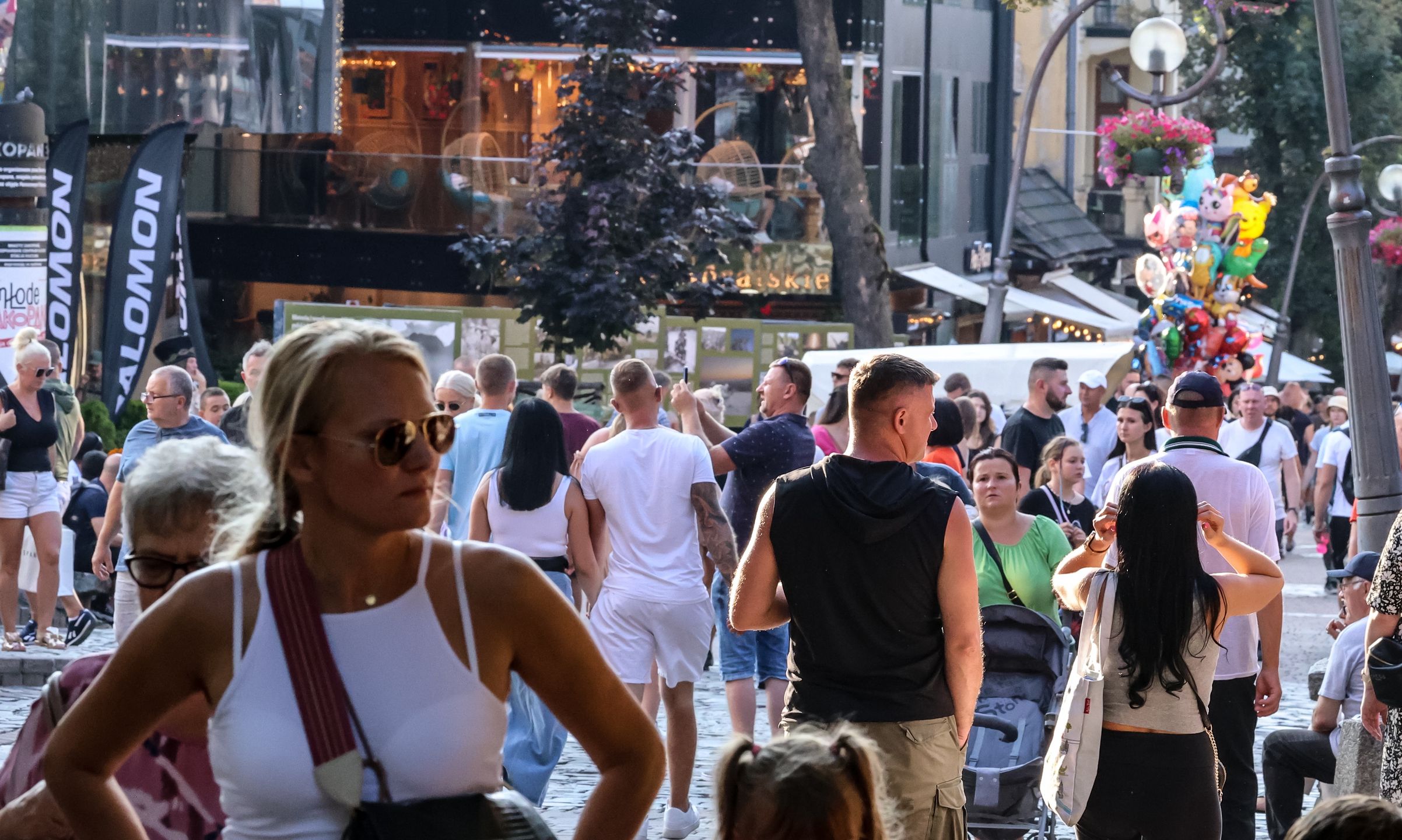 Families walk on a landmark Krupowki Street in the center of Zakopane, a popular Tatra mountain holiday resort on the last weekend of school holiday in Southern Poland on August 30, 2024. (Photo by Dominika Zarzycka/NurPhoto via Getty Images)