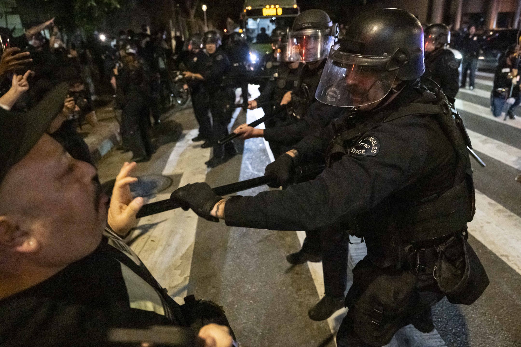 Los Angeles Police Department (LAPD) officers and demonstrators clash during a dispersal operation in downtown Los Angeles, California, United States on January 30, 2026