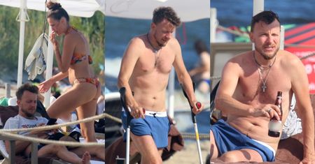 Kontuzjowany Piotr Kupicha popija zimne piwko i relaksuje się na plaży w Sopocie z żoną i córką (ZDJĘCIA)