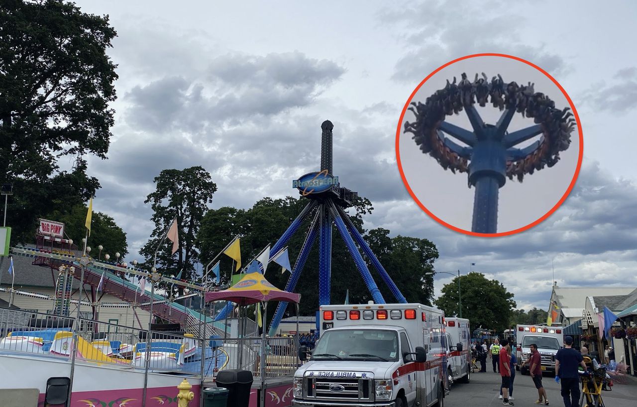 The carousel in the amusement park stopped right at the moment when people were hanging upside down.