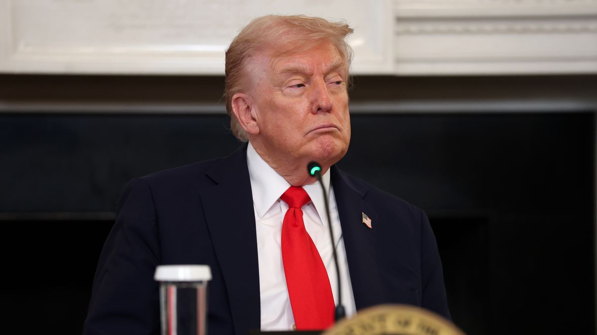 WASHINGTON, DC - OCTOBER 08: U.S. President Donald Trump listens to speakers during a roundtable discussion in the State Dining Room of the White House on October 08, 2025 in Washington, DC. Trump’s administration held the roundtable to discuss the anti-fascist Antifa movement after signing an executive order designating it as a “domestic terrorist organization”. (Photo by Anna Moneymaker/Getty Images)