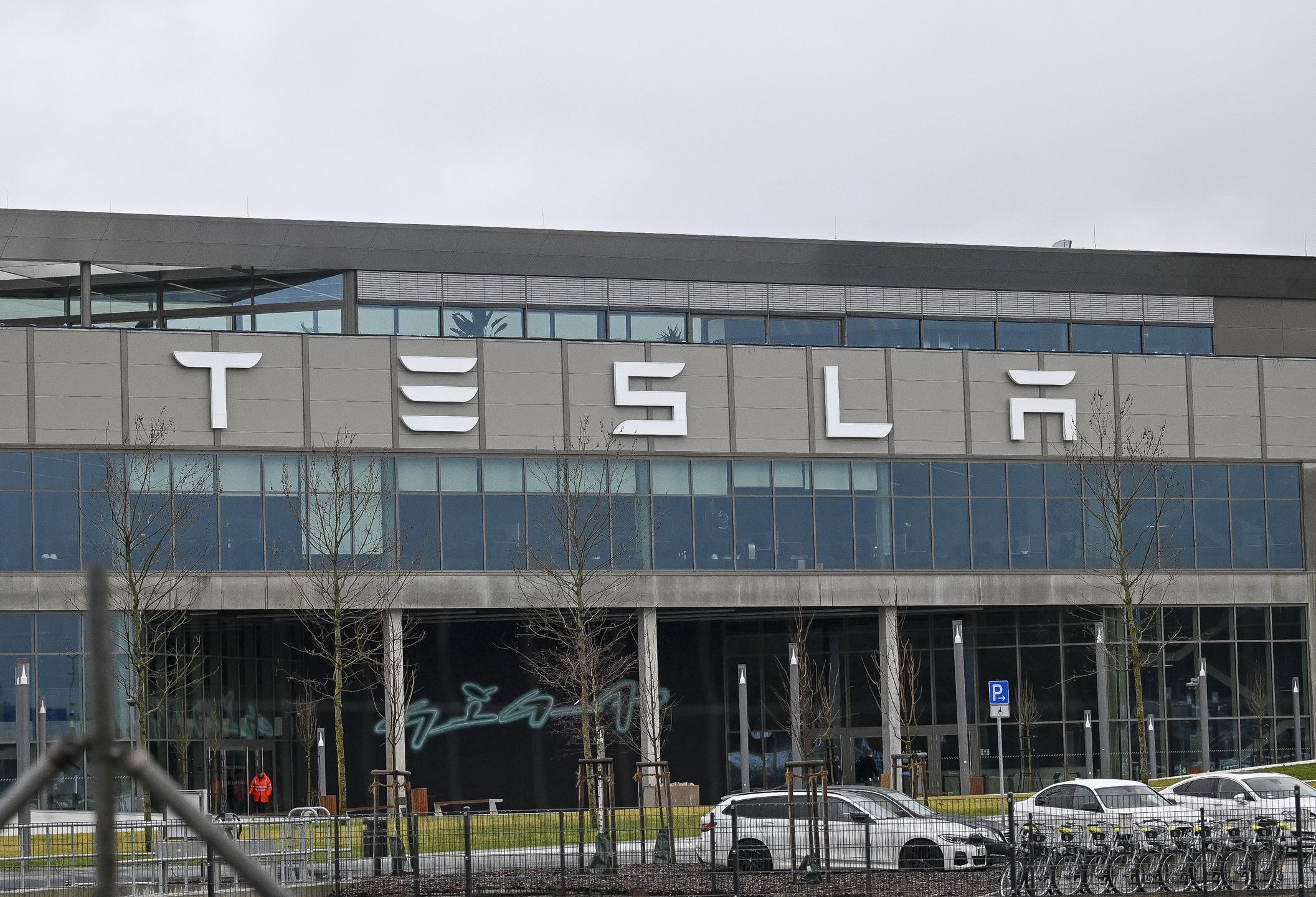 BERLIN, GERMANY - FEBRUARY 22: ''Tesla'' logo is seen on the Tesla factory building in Berlin, Germany on February 22, 2024. In the southeastern outskirts of Berlin, within the Grunheide district, local residents are expressing opposition to the expansion plans of the first automobile factory of US electric car manufacturer, Tesla in Europe. The proposed expansion has sparked discontent among the community members in the area. (Photo by Halil Sagirkaya/Anadolu via Getty Images)