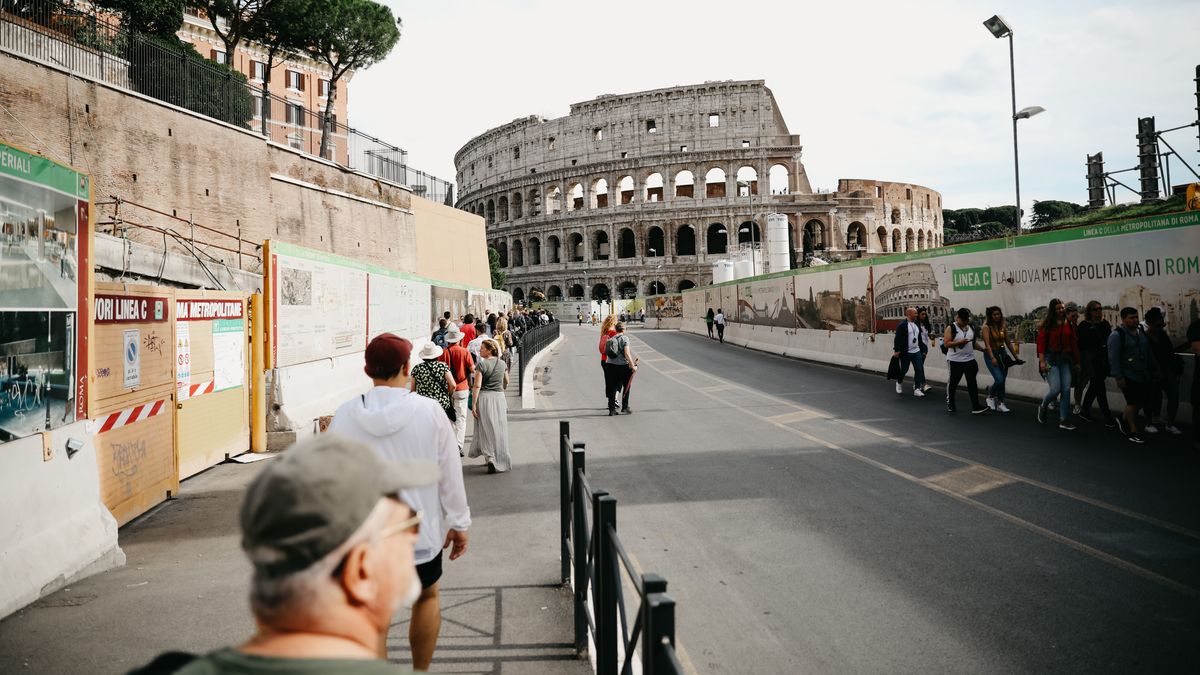 Tourists walking ahead of Coloseum in Rome, Italy (Photo by AB/NurPhoto via Getty Images)