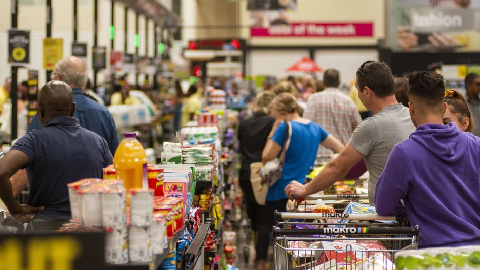Shoppers wait in long queues at the check-out aisle inside a Makro wholesale store, operated by Masstores (Pty) Ltd., in Pretoria, South Africa, on Monday, March 16, 2020. South Africa declared a national state of disaster, halted inbound flights from countries worst affected by the coronavirus, shut schools and banned public gatherings of more than 100 people in a bid to contain the spread of the disease. Photographer: Waldo Swiegers/Bloomberg via Getty Images
