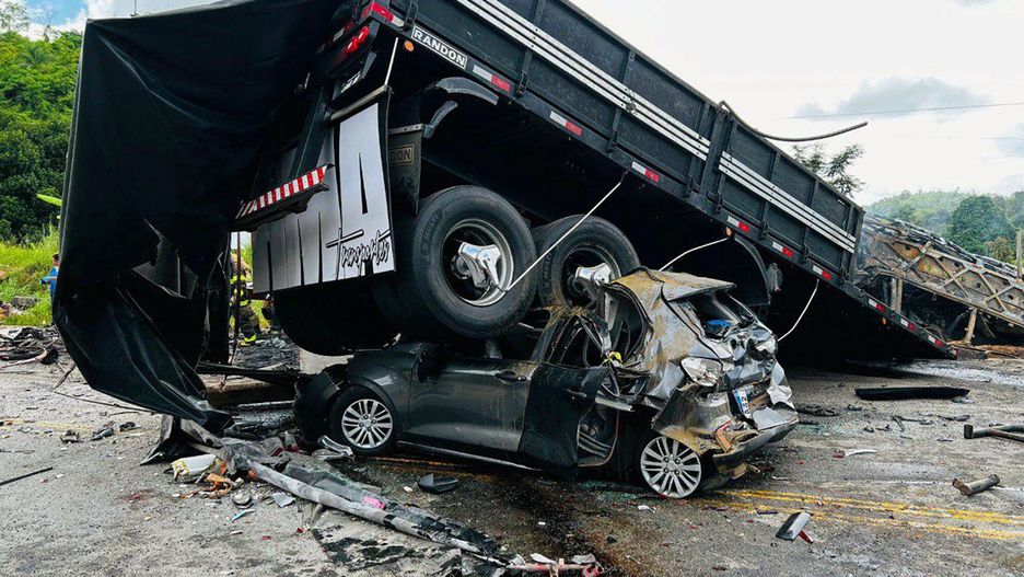 Temporary
Handout picture released by Minas Gerais Fire Department shows a truck on top of a car on the site of a crash in Teofilo Otoni, Minas Gerais state, Brazil on December 21, 2024. An accident involving a car, a truck and a bus, killed 22 people at BR-116 highway according to a press release by Minas Gerais Fire Department. (Photo by Handout / Minas Gerais Fire Department / AFP) / RESTRICTED TO EDITORIAL USE - MANDATORY CREDIT "AFP PHOTO /  Minas Gerais Fire Department / HANDOUT /  " - NO MARKETING NO ADVERTISING CAMPAIGNS - DISTRIBUTED AS A SERVICE TO CLIENTS
HANDOUT