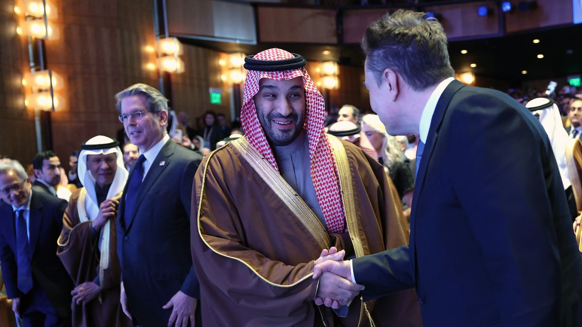 President Trump Participates In U.S.-Saudi Investment Forum At The Kennedy Center
WASHINGTON, DC - NOVEMBER 19: Crown Prince and Prime Minister Mohammed bin Salman of Saudi Arabia greets Tesla CEO Elon Musk as they take their seats to listen to U.S. President Donald Trump deliver remarks at the U.S.-Saudi Investment Forum at the Kennedy Center on November 19, 2025 in Washington, DC. The forum is intended to bring together business leaders, innovators and political leaders with the goal of strengthening economic ties and promoting investment between the United States and Saudi Arabia. Also pictured is Treasury Secretary Scott Bessent. (Photo by Win McNamee/Getty Images)
Win McNamee