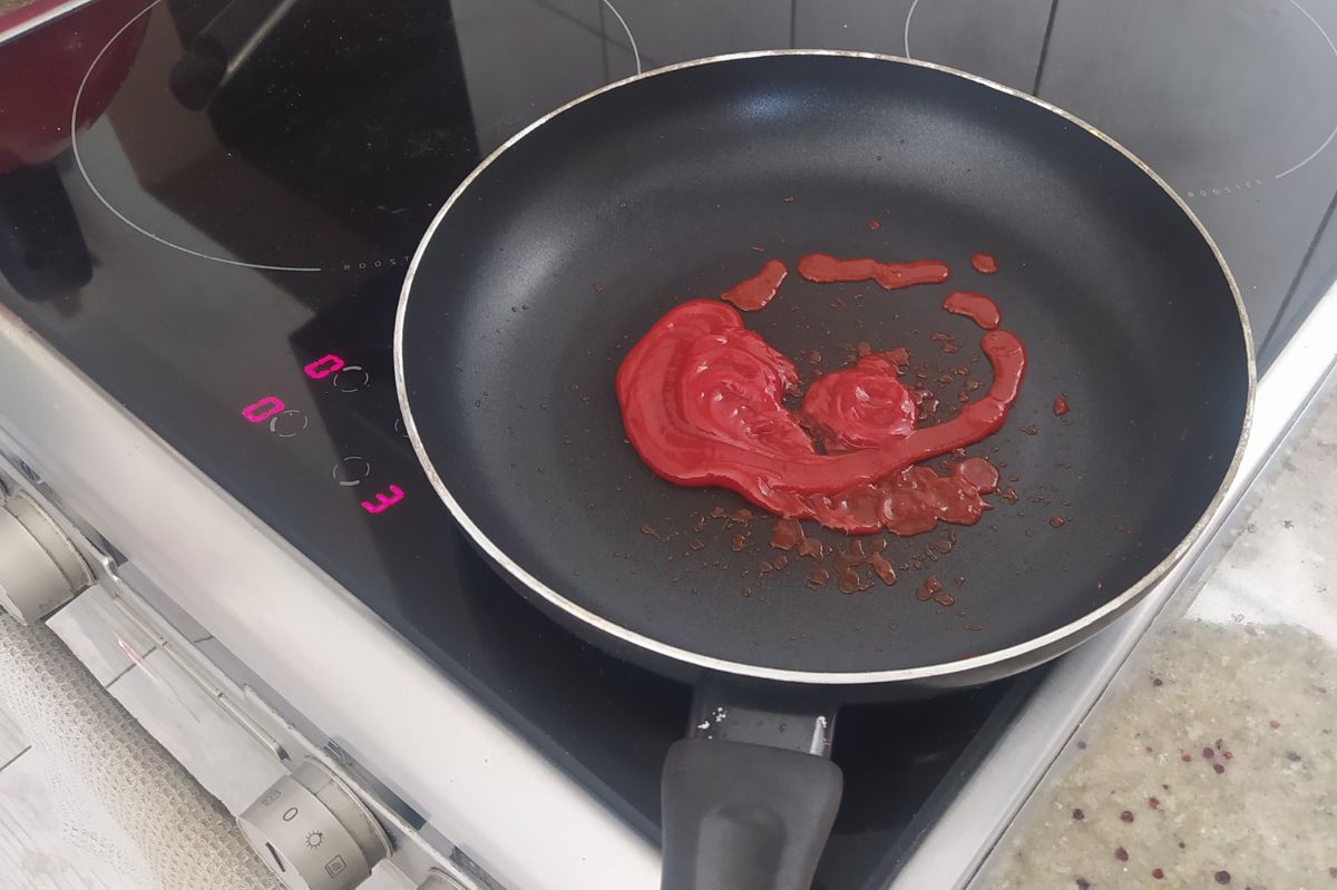 You can remove stains from the frying pan using a popular sauce.