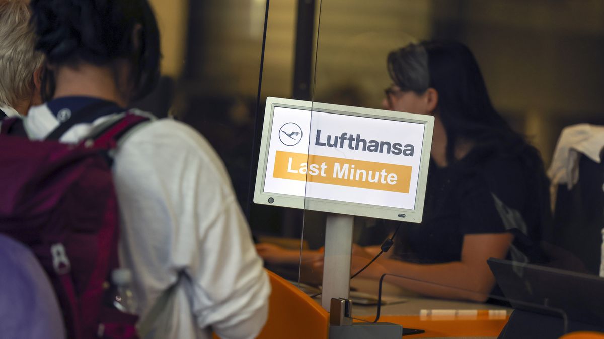 Passengers queue at 'Last Minute' counter for Deutsche Lufthansa AG, during a strike by the airline's pilots, at Terminal 1 of Frankfurt Airport in Frankfurt, Germany, on Friday, Sept. 2, 2022. Lufthansa suspended almost its entire flight operations in Frankfurt and Munich because of a strike by pilots who are demanding higher pay, adding another day of major disruptions to what has already turned into a summer of travel chaos. Photographer: Alex Kraus/Bloomberg via Getty Images