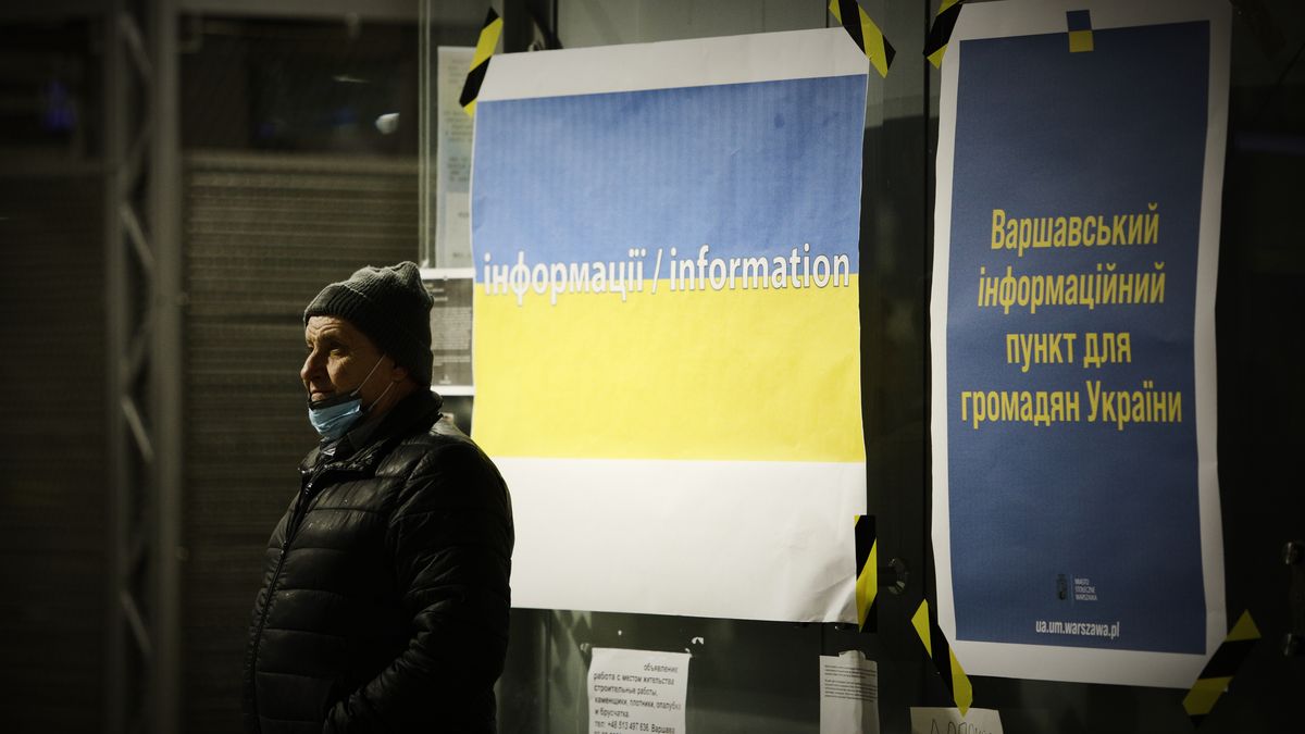 A man stands in front of a refugee support point at the Warsaw East train station in Warsaw, Poland on 04 March, 2022. Every day several thousand refugees arrive in Warsaw train stations, fleeing the violence after Russia's invasion. Nearly one million people have fled Ukraine after the Russian invasion and approximately 700 thousand of those have fled to Poland. Thanks to a number of private and public initiatives and the efforts of local municipalities refugees from Ukraine have been received with open arms and enjoy shelter, free food and free transportation in Poland. (Photo by STR/NurPhoto via Getty Images)