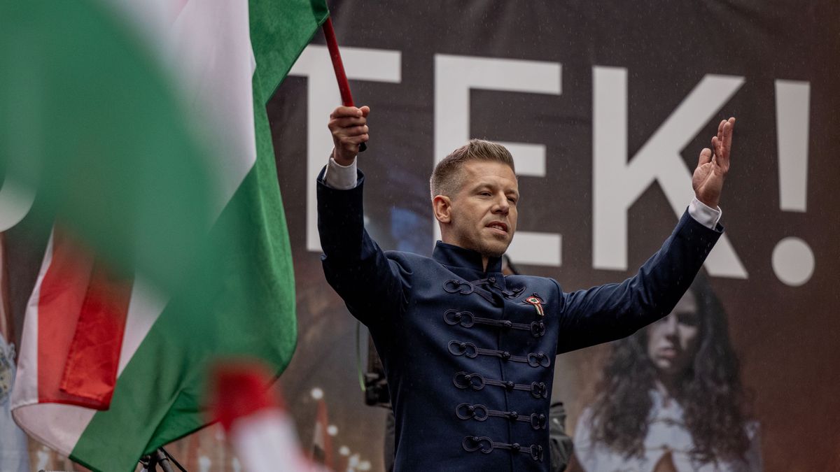 BUDAPEST, HUNGARY - MARCH 15: Peter Magyar, Hungarian oppsition, leader of the 'TISZA' (Respect and Freedom) party, lawyer, former government insider holds the Hungarian flag at a demonstration during commemorations of the 177th anniversary of the 1948/49 Hungarian Revolution on March 15, 2025 in Budapest, Hungary. (Photo by Janos Kummer/Getty Images)