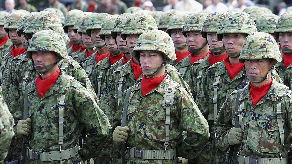 The Annual Inspection Parade Of Japan's Self Defence Forces
TOKYO - OCTOBER 5:  Soldiers from the East Area Division of Japan's Self Defence Forces stand to attention during the annual inspection parade at the Asaka Training Ground on October 5, 2003 in Tokyo, Japan.  The Japanese Parliament is currently discussing the deployment of troops to Iraq. (Photo by Junko Kimura/Getty Images)
Junko Kimura
military Political Army Forces Deployment Troops Soldiers Parade
