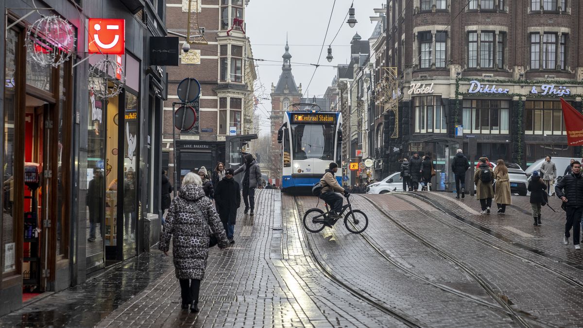 AMSTERDAM, NETHERLANDS - JANUARY 12: People walk near the GVB tram on Nieuwezijds Voorburgwal street on January 12, 2026 in Amsterdam, Netherlands.  (Photo by Alfredo Martinez/Getty Images)
