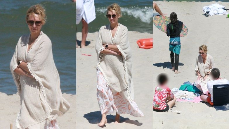 Anna Kalczyńska pije piwo na plaży i fotografuje pociechy