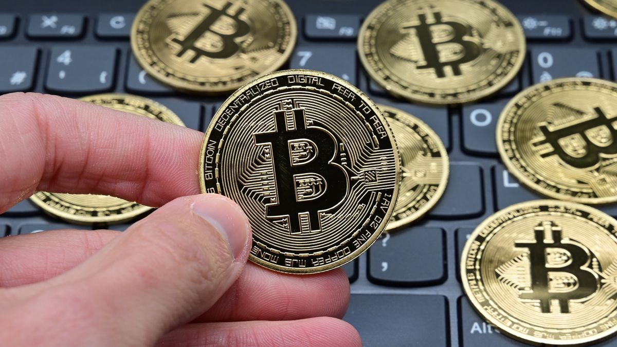 VERANNE, LOIRE, FRANCE - 2020/03/28: In this photo illustration, Bitcoin cryptocurrency coins seen displayed on a laptop keyboard. (Photo Illustration by Romain Doucelin/SOPA Images/LightRocket via Getty Images)