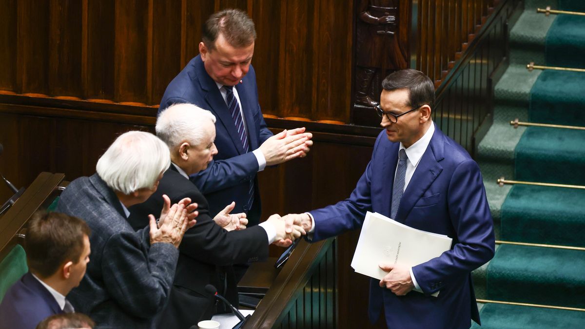 Prime Minister of Poland, Mateusz Morawiecki, shakes hands with Jaroslaw Kaczynski, the leader of PiS party, during the parliament session in Warsaw, Poland on December 11, 2023. Donald Tusk, head of a pro-European alliance, is expected to become Poland's prime minister this week, almost two months after the election.  (Photo by Beata Zawrzel/NurPhoto via Getty Images)