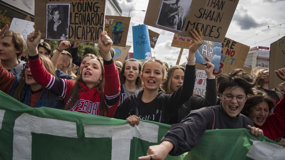 WARSAW, MAZOWIECKIE, POLAND - 2019/09/20: Protesters shout slogans while holding placards during the climate change strike in Warsaw.Thousands of kids, pupils and students took part in a march in Warsaw - organised by Mlodziezowy Strajk Klimatyczny (Youth Strike for Climate) - which is part of the global protests against climate change. Protesters demand action from politicians in the matter of global warming, air and earth pollution. (Photo by Attila Husejnow/SOPA Images/LightRocket via Getty Images)