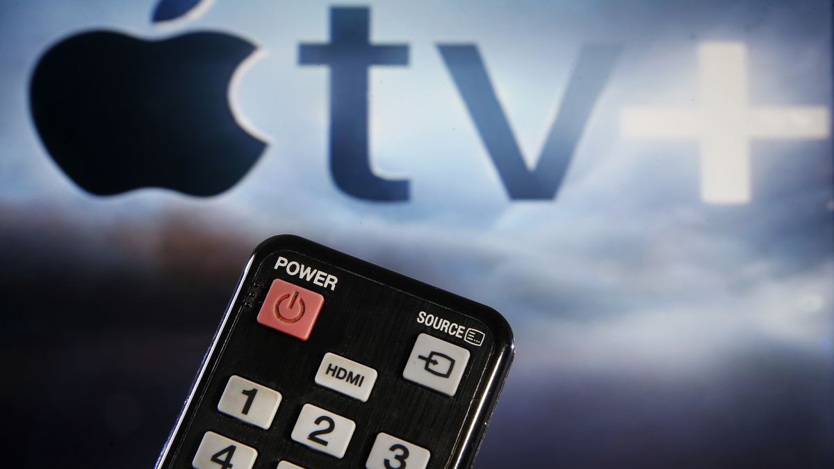 PARIS, FRANCE - MARCH 28: In this photo illustration, a remote control is seen in front of a television screen showing an Apple TV + logo on March 28, 2020 in Paris, France. (Photo by Chesnot/Getty Images)