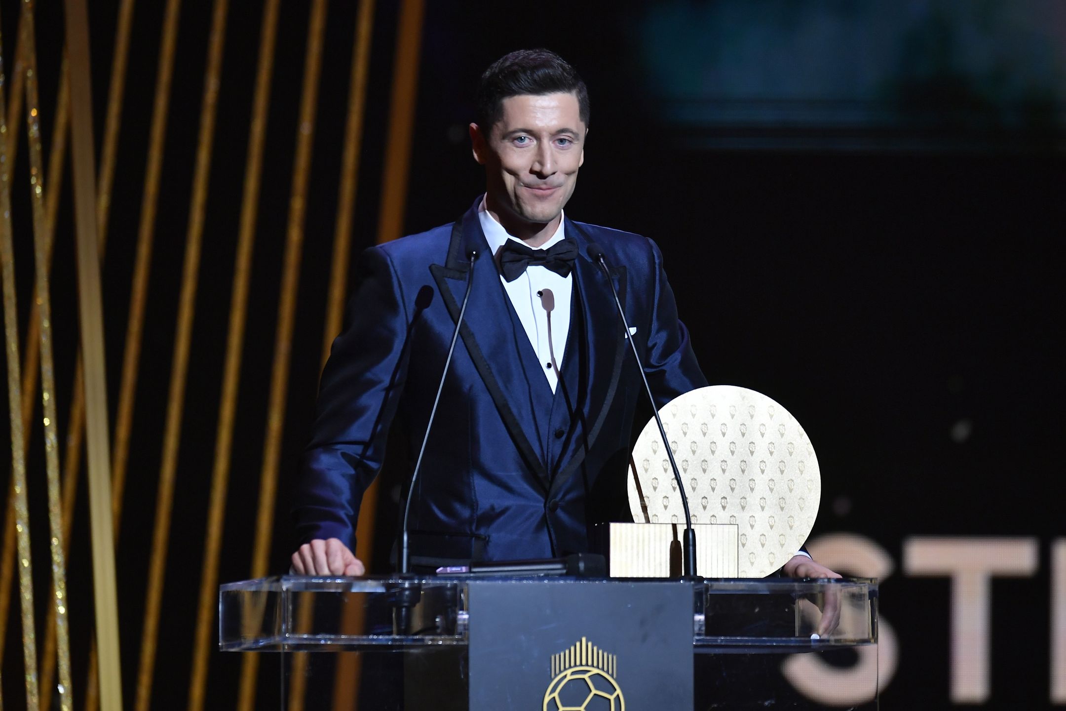 Ballon D'Or : Ceremony At Theatre Du Chatelet In ParisPARIS, FRANCE - NOVEMBER 29: Robert Lewandowski (POL/Bayern Munich) receives the Striker Trophy during the Ballon D'Or ceremony at Theatre du Chatelet on November 29, 2021 in Paris, France. (Photo by Aurelien Meunier/Getty Images)Aurelien Meunier