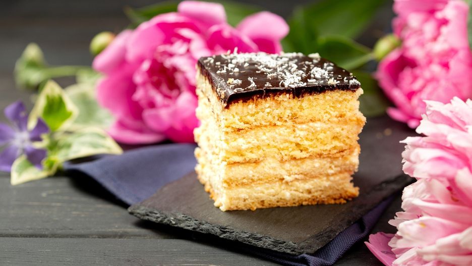 A piece of cheesecake on slate plate