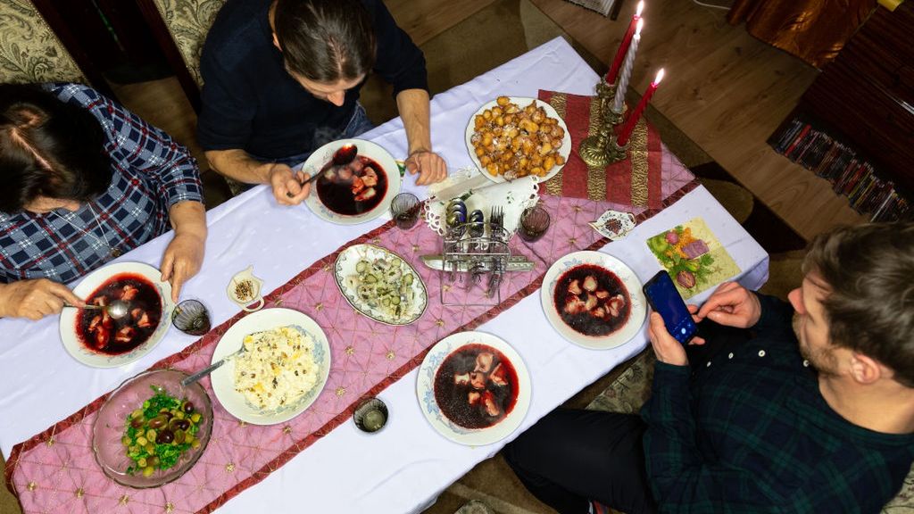 Christmas Celebration Amid Covid-19 In Poland
Members of a family celebrate Christmas Eve dinner in very limited numbers amid Coronavirus partial lockdown on December 24, 2020 in a provincial town Ostrowiec Swietokrzyski, Poland. Christmas Eve is the most celebrated day in Polish family calendar and families usually meet in multigenerational large events. In 2020 due to Cavid-19 pandemic families joined together for a traditional dinner only in limited numbers as it is not advised to mix between households. (Photo by Dominika Zarzycka/NurPhoto via Getty Images)
NurPhoto
christmas eve, covid 19, daily life, germs, health, holiday, home, implement, indoor, infection, lifestyle, lights, limitations, pandemic, person, policy, population health, protect, restrictions, sars, social life, social problem, spread, together