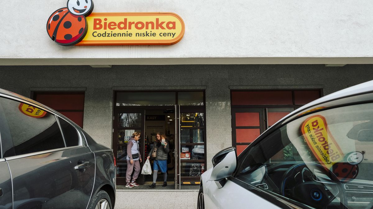 A customer exits a Biedronka supermarket in Warsaw, Poland, on Monday, March 20, 2023. Poland's February retail sales fell 5% as prices rose 10.8% from a year earlier, data from the Central Statistical Office in Warsaw shows. Photographer: Damian Lemaski/Bloomberg via Getty Images