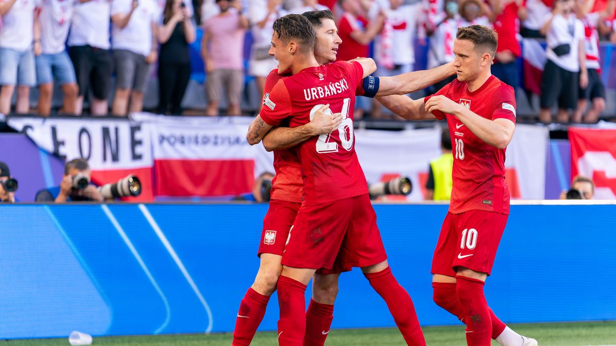 DORTMUND, GERMANY - JUNE 25: Robert Lewandowski of Poland celebrates after scoring the team's first goal with Kacper Urbanski of Poland and Piotr Zielinski of Poland during the Group D - UEFA EURO 2024 match between France and Poland at BVB Stadion Dortmund on June 25, 2024 in Dortmund, Germany. (Photo by Joris Verwijst/BSR Agency/Getty Images)
