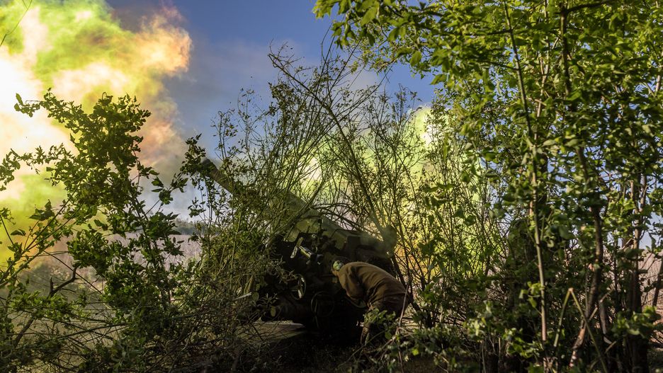 DONETSK OBLAST, UKRAINE - MAY 12: Ukrainian soldiers fire D-30 artillery at their fighting position in the direction of Chasiv Yar as Russia-Ukraine war continues in Donetsk Oblast, Ukraine on May 12, 2024. (Photo by Diego Herrera Carcedo/Anadolu via Getty Images)