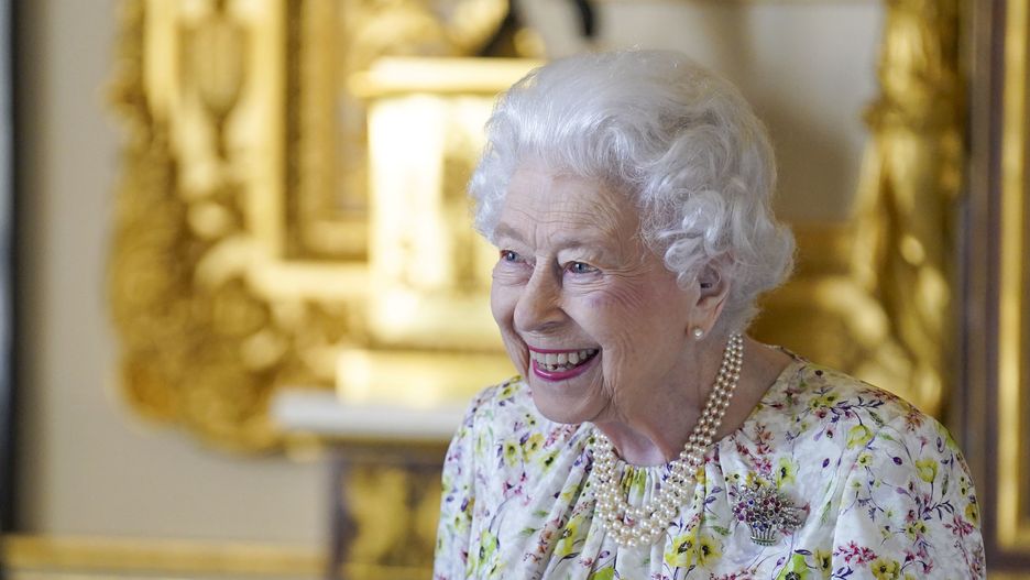 The Queen Commemorates 70th Anniversary Of Halcyon DaysWINDSOR, ENGLAND - MARCH 23: Queen Elizabeth II smiles as she arrives to view a display of artefacts from British craftwork company, Halcyon Days, to commemorate the company's 70th anniversary in the White Drawing Room at Windsor Castle, on March 23, 2022 in Windsor, England. The Queen viewed a selection of hand-decorated archive enamelware and fine bone china, including their earliest designs from the 1950s. (Photo Steve Parsons - WPA Pool/Getty Images)WPA Pool