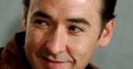 John Cusack jednak poleci