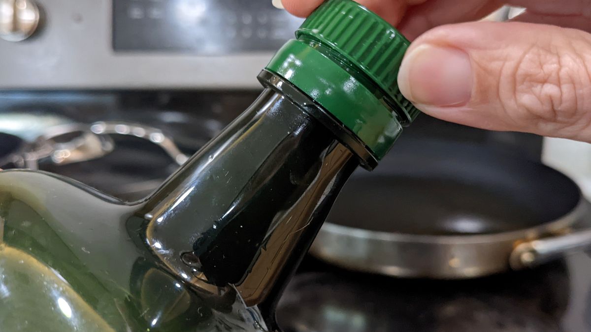 Twisting
Twisting the top off of a bottle of olive oil
Photo by Cathy Scola