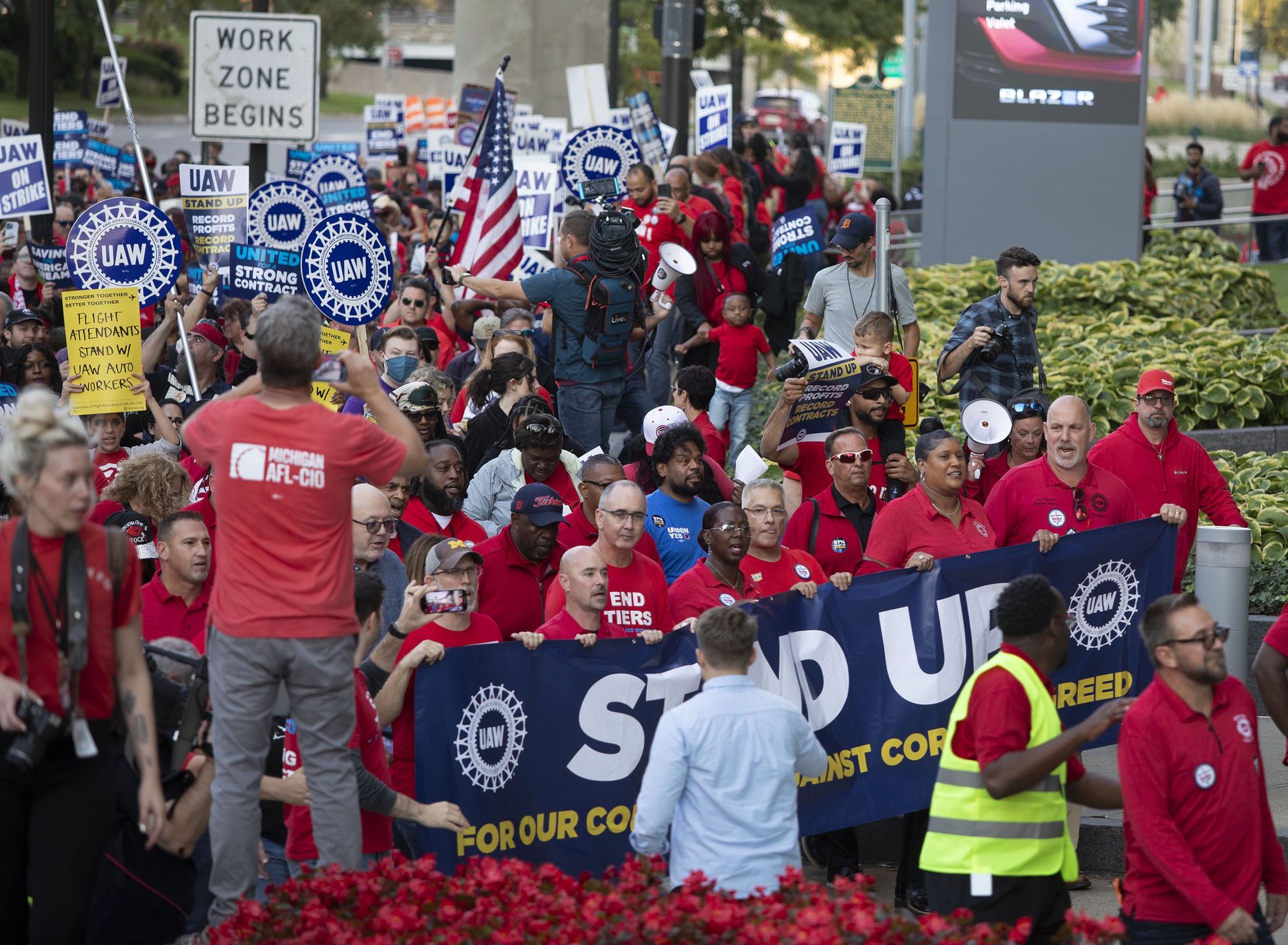 DETROIT, MICHIGAN - SEPTEMBER 15: UAW President Shawn Fain marches with UAW members through downtown Detroit  after a rally in support of United Auto Workers members as they strike the Big Three auto makers on September 15, 2023 in Detroit, Michigan. This is the first time in history that the UAW is striking all three of the Big Three auto makers, Ford, General Motors, and Stellantis, at the same time. (Photo by Bill Pugliano/Getty Images)