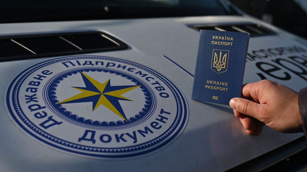 A Ukrainian citizen holds a passport next to the mobile passport office in Krakow.
Mobile passport points for Ukrainian citizens in Poland have been operating for a couple of weeks in Krakow, Gdansk and Warsaw. 
They are aimed at speeding up and facilitating administrative activities for people who left Ukraine invaded by the Russians without a passport.
New points will be soon opened in Poland and other countries, including Germany, Slovakia and Turkey.
On Thursday, October 13, 2022, in Krakow, Lesser Poland Voivodeship, Poland. (Photo by Artur Widak/NurPhoto via Getty Images)