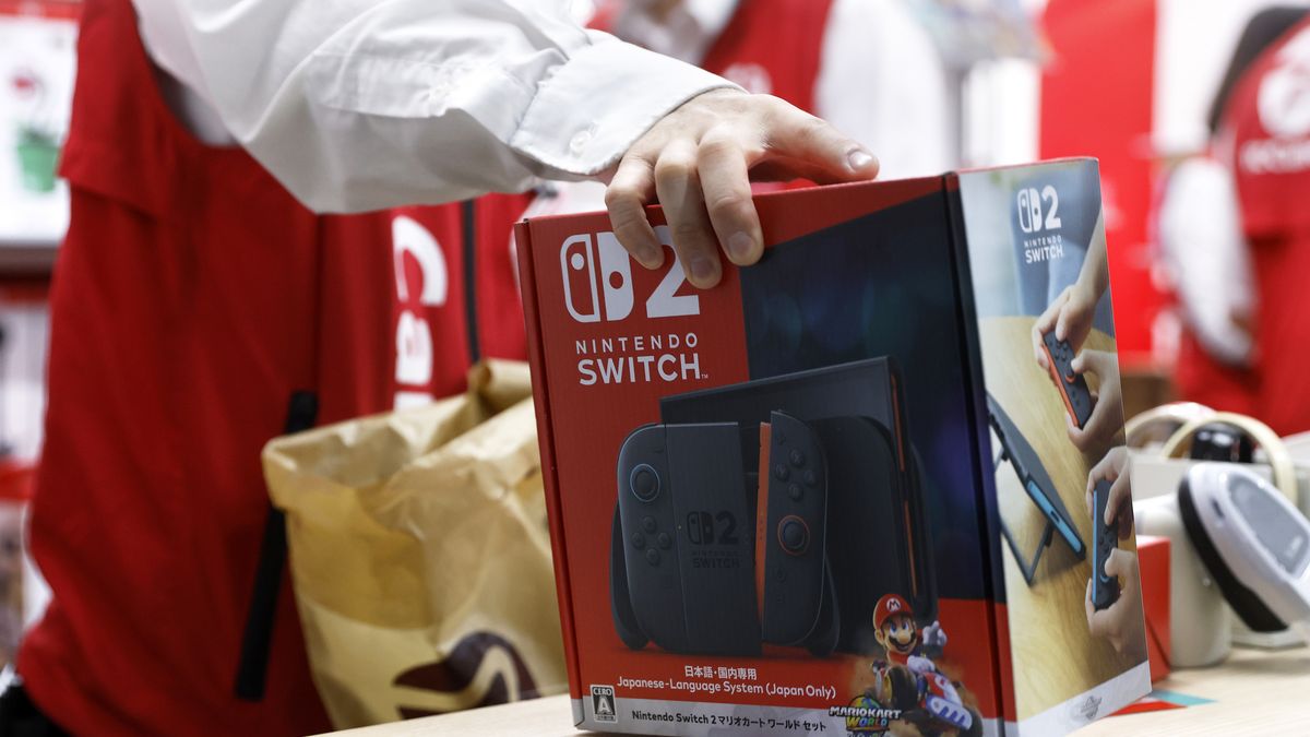 An employee handles a Nintendo Co. Switch 2 game console at a Bic Camera Inc. electronics store in Tokyo, Japan, on Thursday, June 5, 2025. Nintendo Co. fans from Tokyo to Manhattan stood in line for hours to be among the first to get a Switch 2, fueling one of the biggest global gadget debuts since the iPhone launches of yesteryear. Photographer: Kiyoshi Ota/Bloomberg via Getty Images